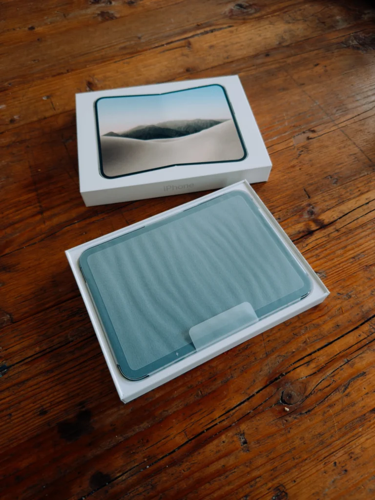 Open box with the Duo lying unfolded under a protective film