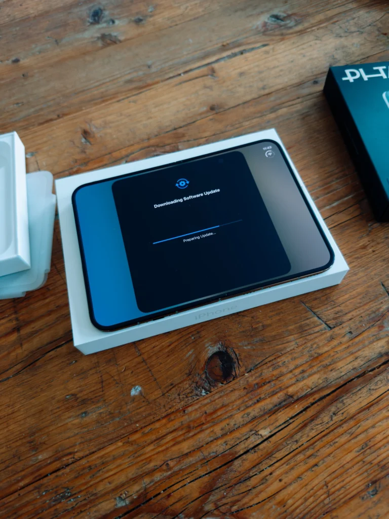 Unfolded iPhone Duo in the box downloading a software update